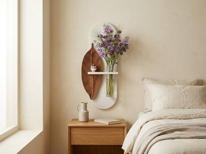 Wooden leaf wall art displayed on a modern hallway wall