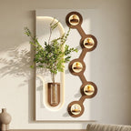 LED wall art with circular accent lighting and glass vase